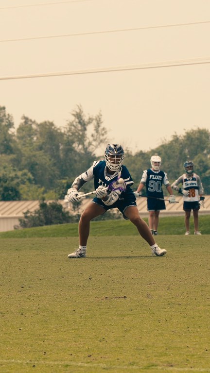 A Fluid Lacrosse player during a summer tournament game