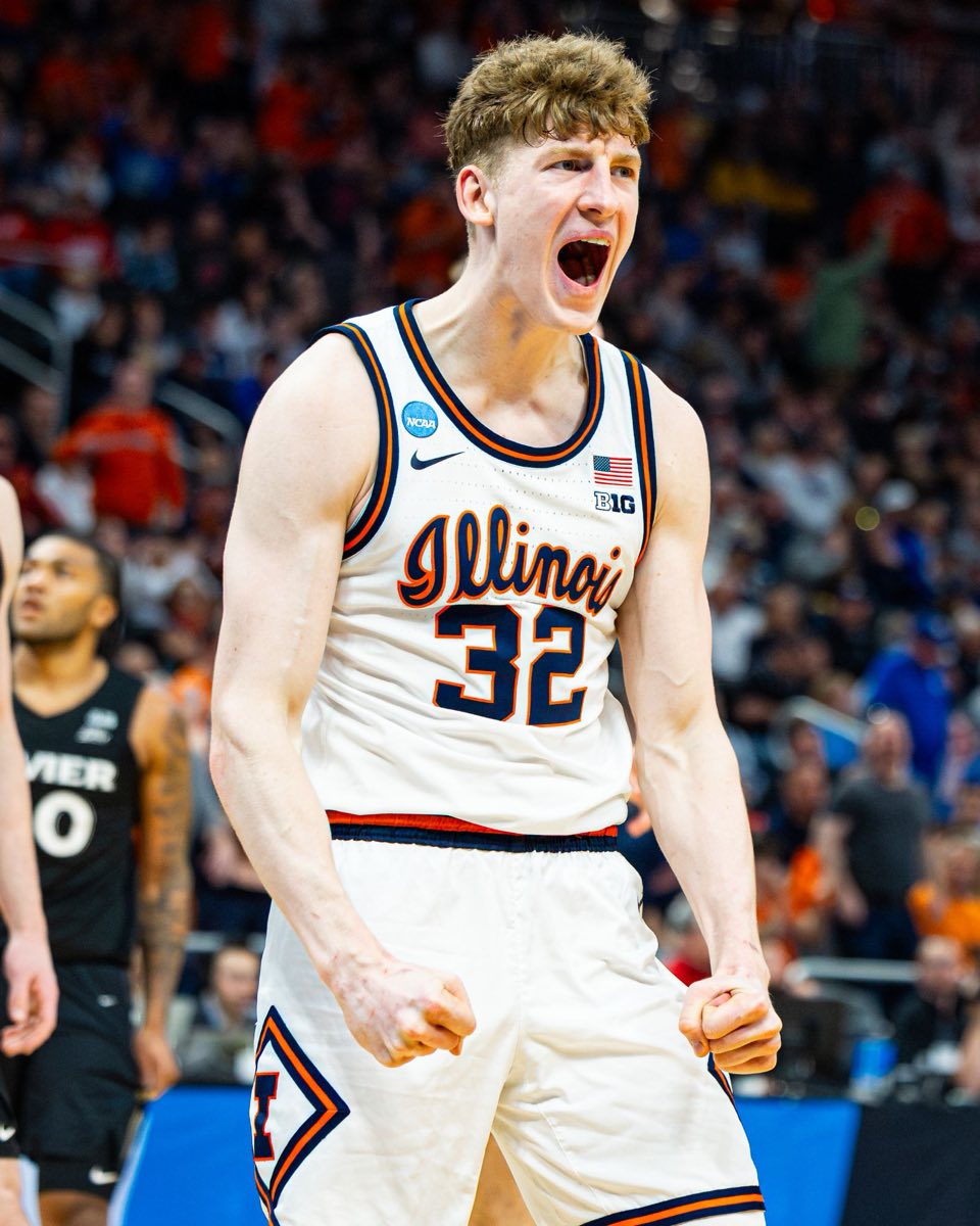 An Illinois basketball player celebrating during an NCAA tournament game